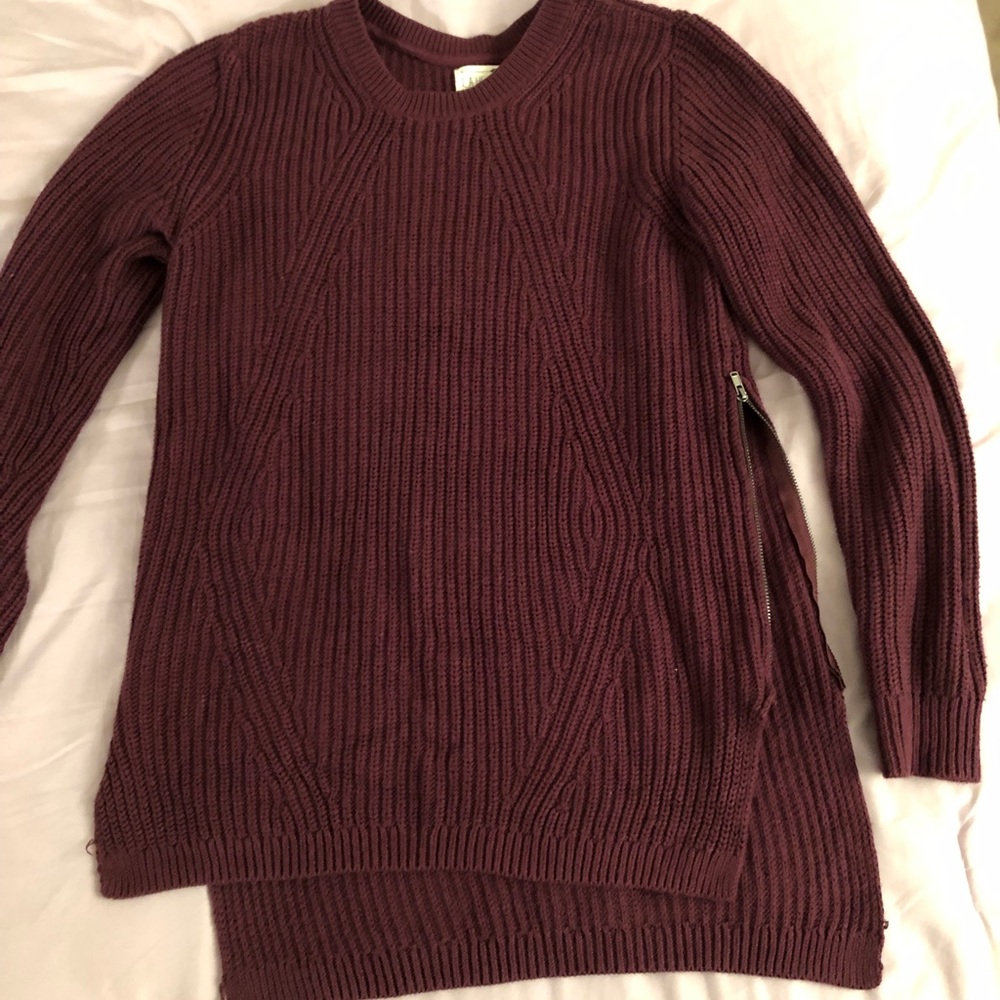 Maroon sweater with zippers on sides